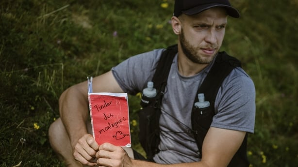 Thibaud Monney poses with the Mountain Tinder notebook