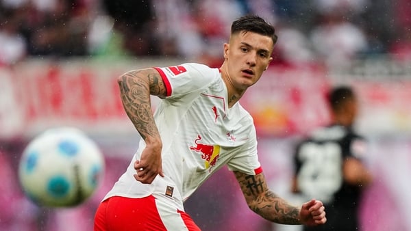 Benjamin Sesko of RB Leipzig looks on as a ball comes towards him.