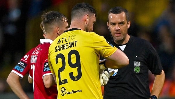 Referee Robert Harvey shows a red card to Sligo Rovers goalkeeper Sam Sargeant during game against Shelbourne - August 2025