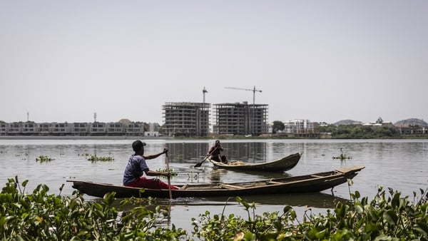 fishermen on boats on a lake in nigeria