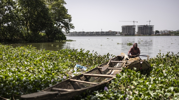 Squeezed By Urban Growth, Nigerian Fishermen Stick To Tradition 2 fisherman on a boat on a lake in nigeria