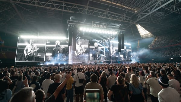 The crowd waits for Oasis to take to the stage at the Principality Stadium, Cardiff, as the band's long-awaited reunion tour kicks off in Wales on 4 July 2025