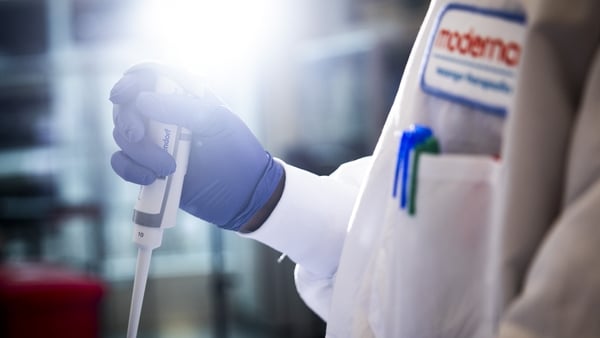 An laboratory workers uses medical equipment in a laboratory
