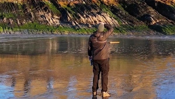 A man taking a photo of a castle