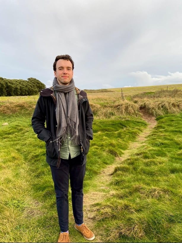 Hugh Wright standing in a field