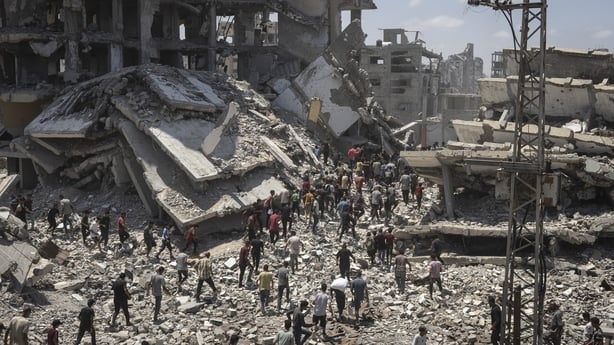 GAZA CITY, GAZA - AUGUST 7: Planes drop aid packages by parachute amid Israeli attacks as the Palestinians flock to the area where the humanitarian aid packages land over western Gaza City, Gaza on August 7, 2025. (Photo by Mahmoud Abu Hamda/Anadolu via Getty Images)