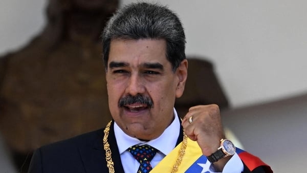 Venezuela's President Nicolas Maduro gestures as he leaves the Capitolio -home of the National Assembly