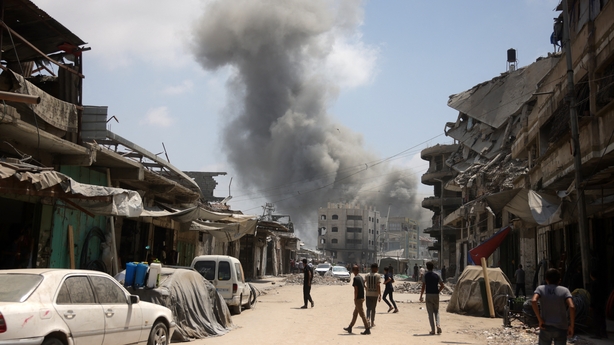 A plume of smoke rises after an Israeli strike hits a neighbourhood in southern Gaza City
