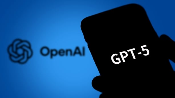 In this photo illustration, the logo of GPT-5 is displayed on a smartphone screen with an Open AI logo in the background