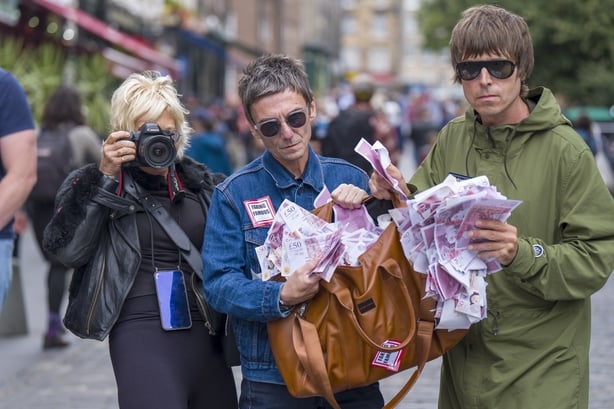 Lookalikes of Liam and Noel Gallagher get into character, with artist Alison Jackson, in The Grassmarket, Edinburgh, to promote the Edinburgh Fringe Festival show, "Alison Jackson's Celebrity Fake Takes". Picture date: Friday August 8, 2025. PA Photo. The real Gallagher brothers will begin the Edinb