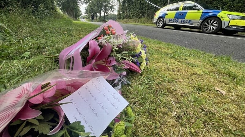 Flowers left at a police cordon near the home where Vanessa Whyte and her two children were shot