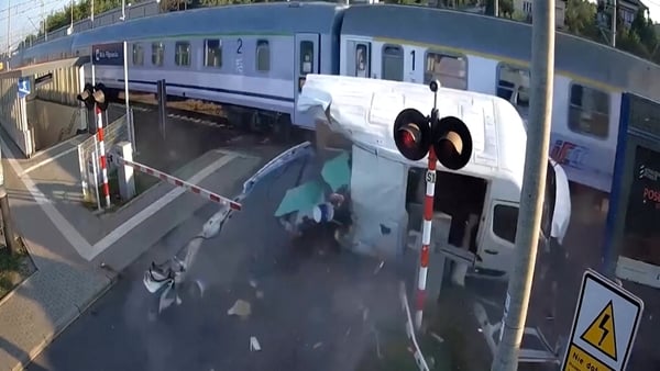 Train crashes into van at level crossing