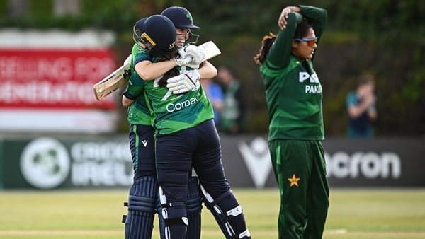 8 August 2025; Ireland batter Jane Maguire, right, is congratulated by teammate Rebecca Stokell after hitting the winning runs during match two of the Women's T20 International Series between Ireland and Pakistan at Castle Avenue Cricket Ground in Dublin.