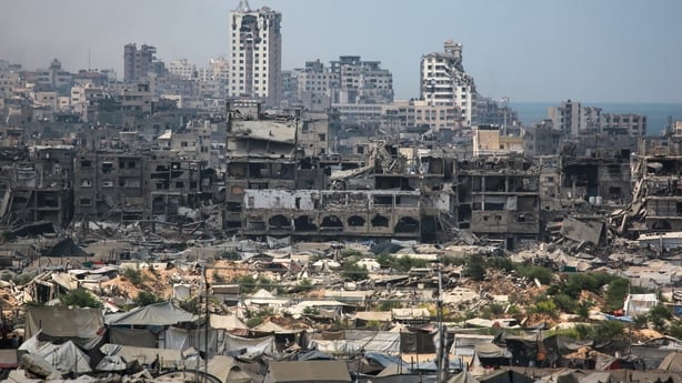 Buildings destroyed in Israeli strikes surround makeshift shelters for displaced Palestinians in Gaza City