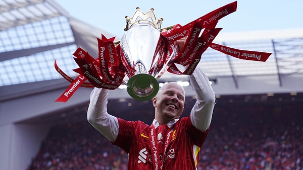 Liverpool manager Arne Slot celebrates with the Premier League trophy