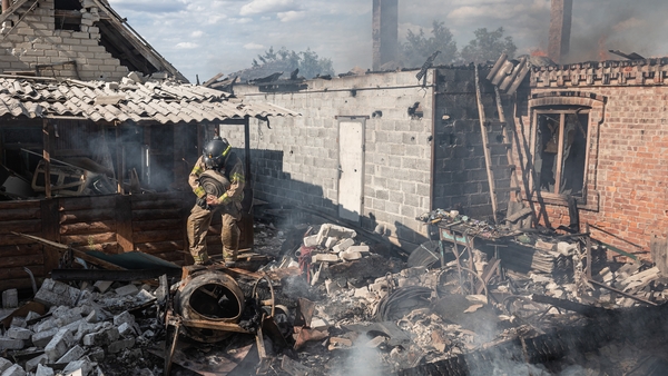 Ukrainian firefighters extinguish a fire in a house after Russian artillery shelling of the city of Kostiantynivka, Ukraine