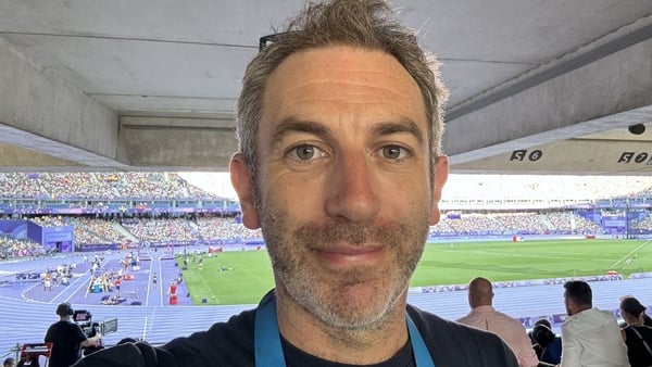 David Coughlan, writer for Sunday Miscellany, selfie headshot, in the stands in a sport stadium