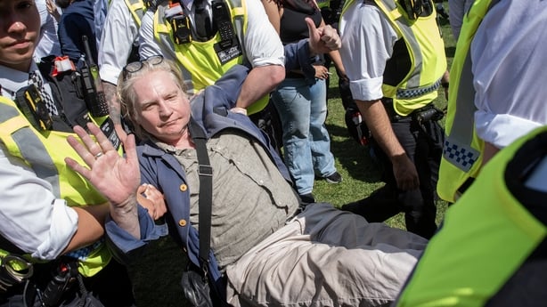 LONDON, UNITED KINGDOM - 2025/08/09: A protester is taken away by the police officers after his arrest during the demonstration. Demonstrators gathered on the Parliament Square in London, UK. The protesters aim was to show their support to the Palestine Action and also, to demand from the British go
