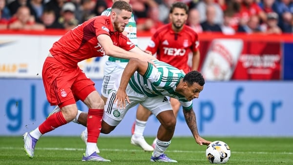 ABERDEEN, SCOTLAND - AUGUST 10: Celtic's Adam Idah (R) and Aberdeen's Alfie Dorrington in action during a William Hill Premiership match between Aberdeen and Celtic at Pittodrie, on August 10, 2025, in Aberdeen, Scotland. (Photo by Rob Casey/SNS Group via