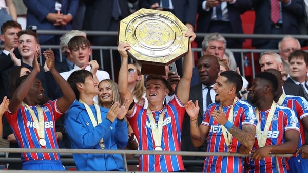 LONDON, ENGLAND - AUGUST 10: Justin Devenny of Crystal Palace holds aloft the FA Community Shield in celebration during the 2025 FA Community Shield match between Crystal Palace and Liverpool at Wembley Stadium on August 10, 2025 in London, England. (Phot