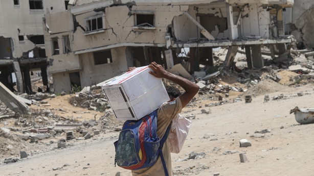 GAZA CITY, GAZA - AUGUST 9: Parachutes drop humanitarian aid over the el-Kerame neighborhood in northern Gaza, as residents face starvation due to the blockade imposed by Israel, in Gaza Strip, on August 9, 2025. (Photo by Khames Alrefi/Anadolu via Getty Images)