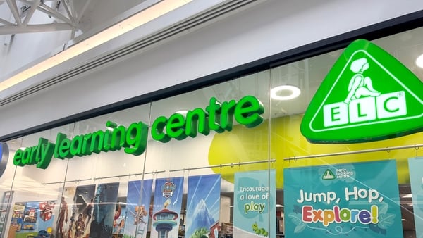 The colourful front of an Early Learning Centre shop with the company's green logo on top of it