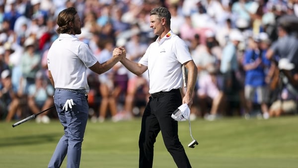 Justin Rose of England shakes hands with Tommy Fleetwood of England on the 18th hole green after finishing the final round of the 2025 FedEx St Jude Championship