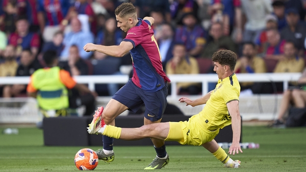 BARCELONA, SPAIN - MAY 18: Fermin Lopez of FC Barcelona competes for the ball with Pau Navarro of Villarreal CF during the LaLiga match between FC Barcelona and Villarreal CF at Estadi Olimpic Lluis Companys on May 18, 2025 in Barcelona, Spain. (Photo by