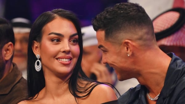 Georgina Rodríguez and Cristiano Ronaldo smile at one another