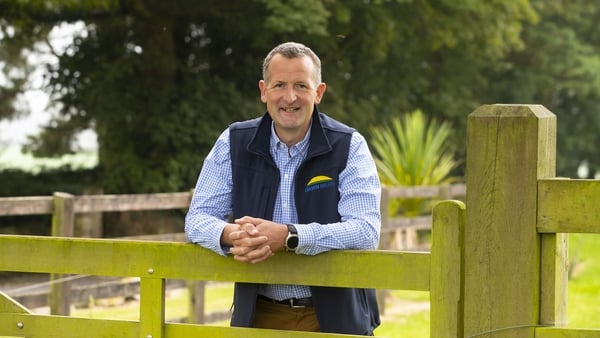 Niall Browne, the CEO of Dawn Meats, pictured at a fence in the countryside