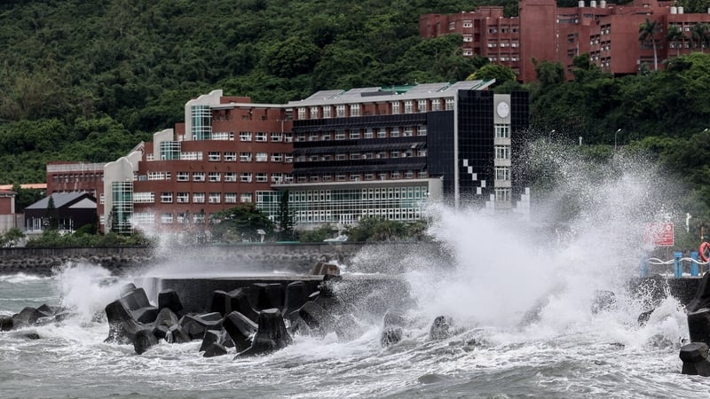 Waves generated by Typhoon Podul break along the coast in Kaohsiung, Taiwan