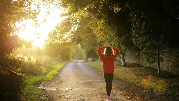 A woman walking in the countryside