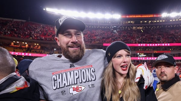 KANSAS CITY, MISSOURI - JANUARY 26: Taylor Swift celebrates with Travis Kelce #87 of the Kansas City Chiefs after defeating the Buffalo Bills 32-29 in the AFC Championship Game at GEHA Field at Arrowhead Stadium on January 26, 2025 in Kansas City, Missour