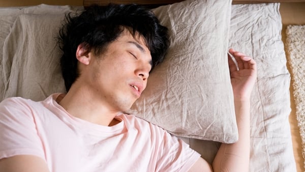 Asian man before waking up in the morning.