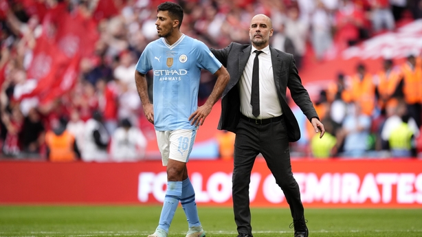 Manchester City manager Pep Guardiola (right) and Manchester City's Rodri after the Emirates FA Cup final at Wembley Stadium in 2024