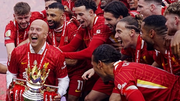 Liverpool manager Arne Slot lifts the Premier League trophy with the players