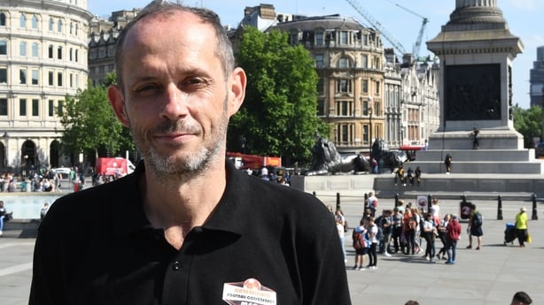 Matabeleland's English coach Justin Walley poses in Trafalgar square during a sightseeing tour of London on the sidelines of the alternative World Football Cup on June 8, 2018. - Matabeleland have gone on a dramatic journey from having two balls and a dirt field to becoming the all-singing, all-danc