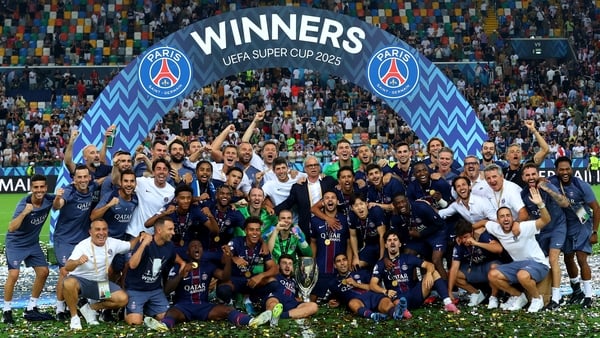 Paris Saint-Germain celebrate with the UEFA Super Cup Trophy at Stadio Friuli in Udine, Italy