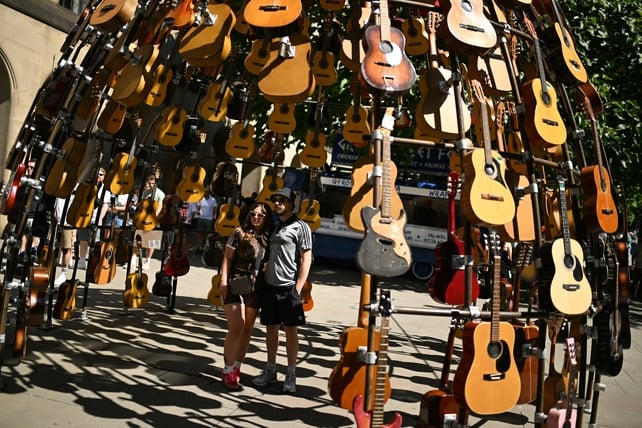 Fans pose in Manchester ahead of Oasis gigs