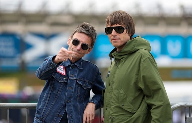 EDINBURGH, SCOTLAND - AUGUST 08: Oasis lookalikes of Liam and Noel Gallagher pose for photographs outside Murrayfield Stadium to promote artist Alison Jackson's Edinburgh Fringe Festival show, "Alison Jackson's Celebrity Fake Takes" on August 08, 2025 in