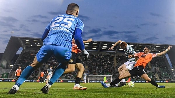 14 August 2025; Rory Gaffney of Shamrock Rovers shoots to score his side's second goal despite the efforts of Gentrit Halili of Ballkani during the UEFA Conference League Third Qualifying Round second leg match between Shamrock Rovers and Ballkani at Tall