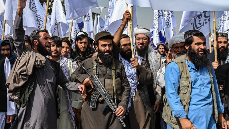 Members of the Taliban shout slogans as they celebrate the fourth anniversary of their takeover of Afghanistan