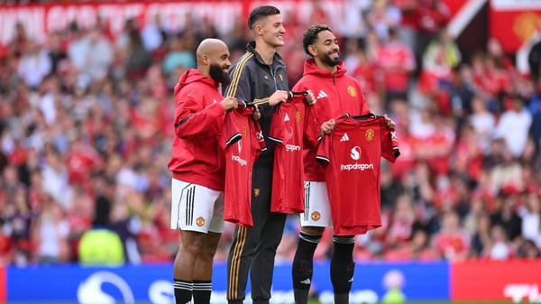 MANCHESTER, ENGLAND - AUGUST 09: New signings Bryan Mbeumo, Benjamin Sesko and Matheus Cunha of Manchester United pose for a photo while holding match shirts prior to the pre-season friendly match between Manchester United and ACF Fiorentina at Old Traffo
