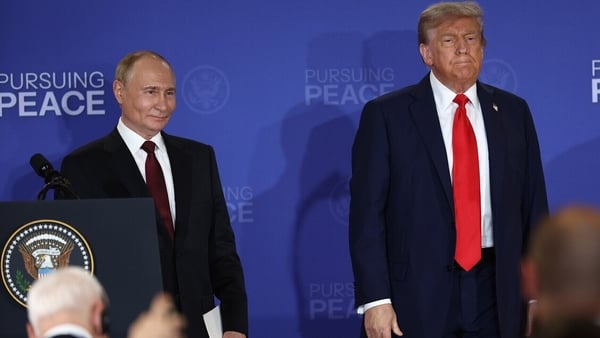 A picture of Vladimir Putin standing next to Donald Trump at a joint press conference