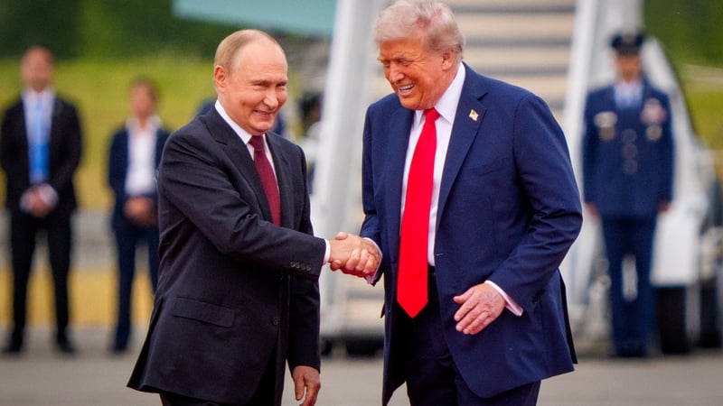 Vladimir Putin greets Donald Trump ahead of the summit