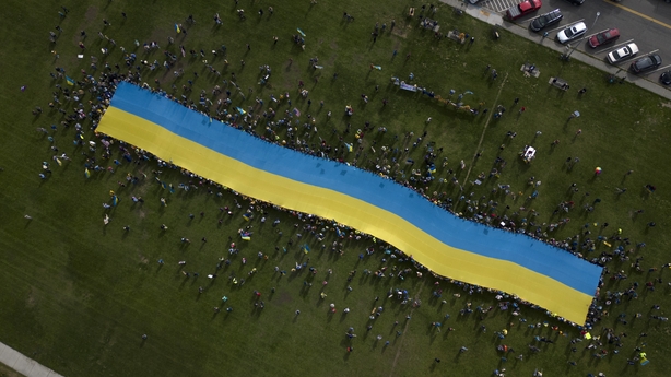 An aerial view shows protesters holding a giant Ukrainian flag in Anchorage, Alaska