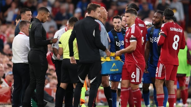 LIVERPOOL, ENGLAND - AUGUST 15: Liverpool players Virgil van Dijk and Dominik Szoboszlai and manager Arne Slot in discussion with AFC Bournemouth player Antoine Semenyo (2r) following reported racist abuse from the crowd during the Premier League match between Liverpool and Bournemouth at Anfield on