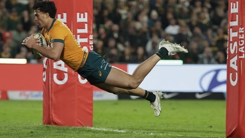 Joseph-Aukuso Suaalii dives across the line