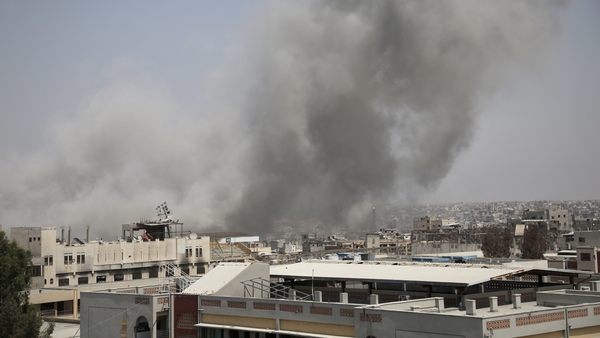Smoke rises after Israeli airstrikes hit residential areas in Khan Younis in the southern Gaza.