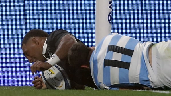 New Zealand's All Blacks wing Sevu Reece scores